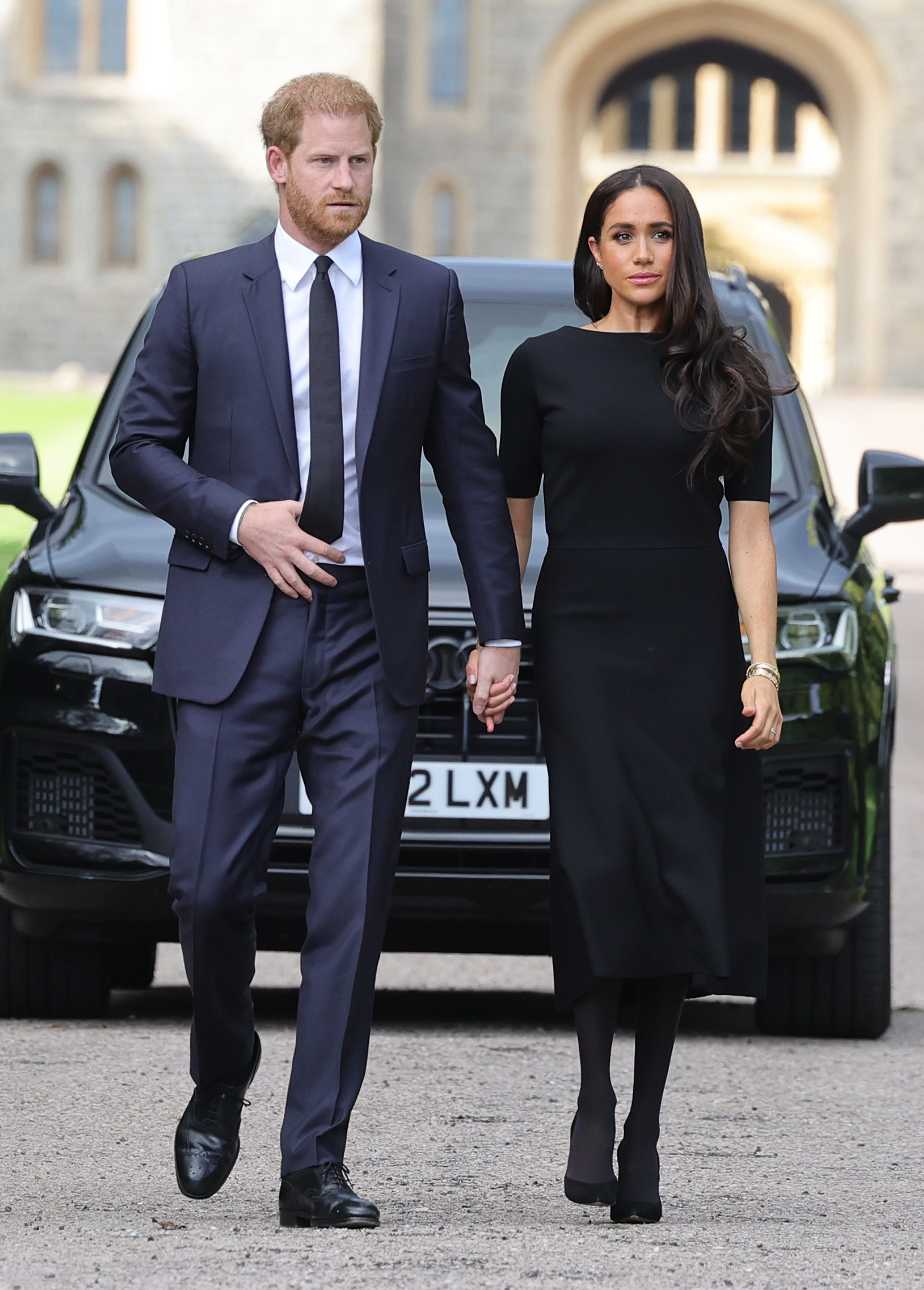 Meghan and Prince Harry holding hands