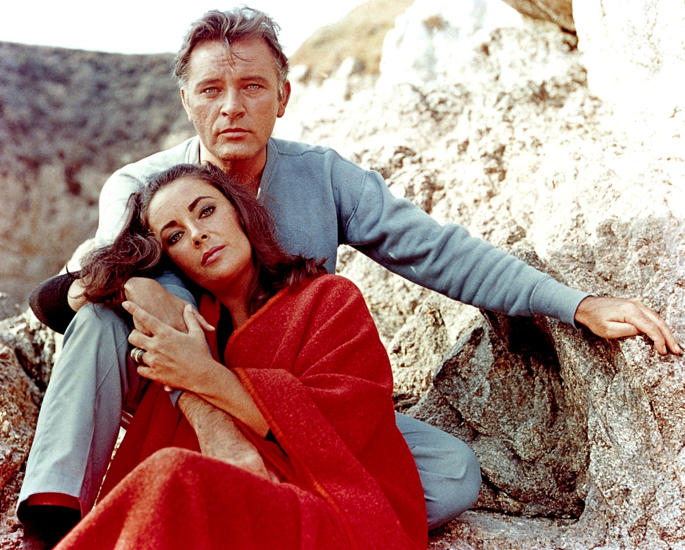 Elizabeth Taylor and Richard Burton pose in between takes while filming &quot;The Sandpiper&quot; circa 1965
