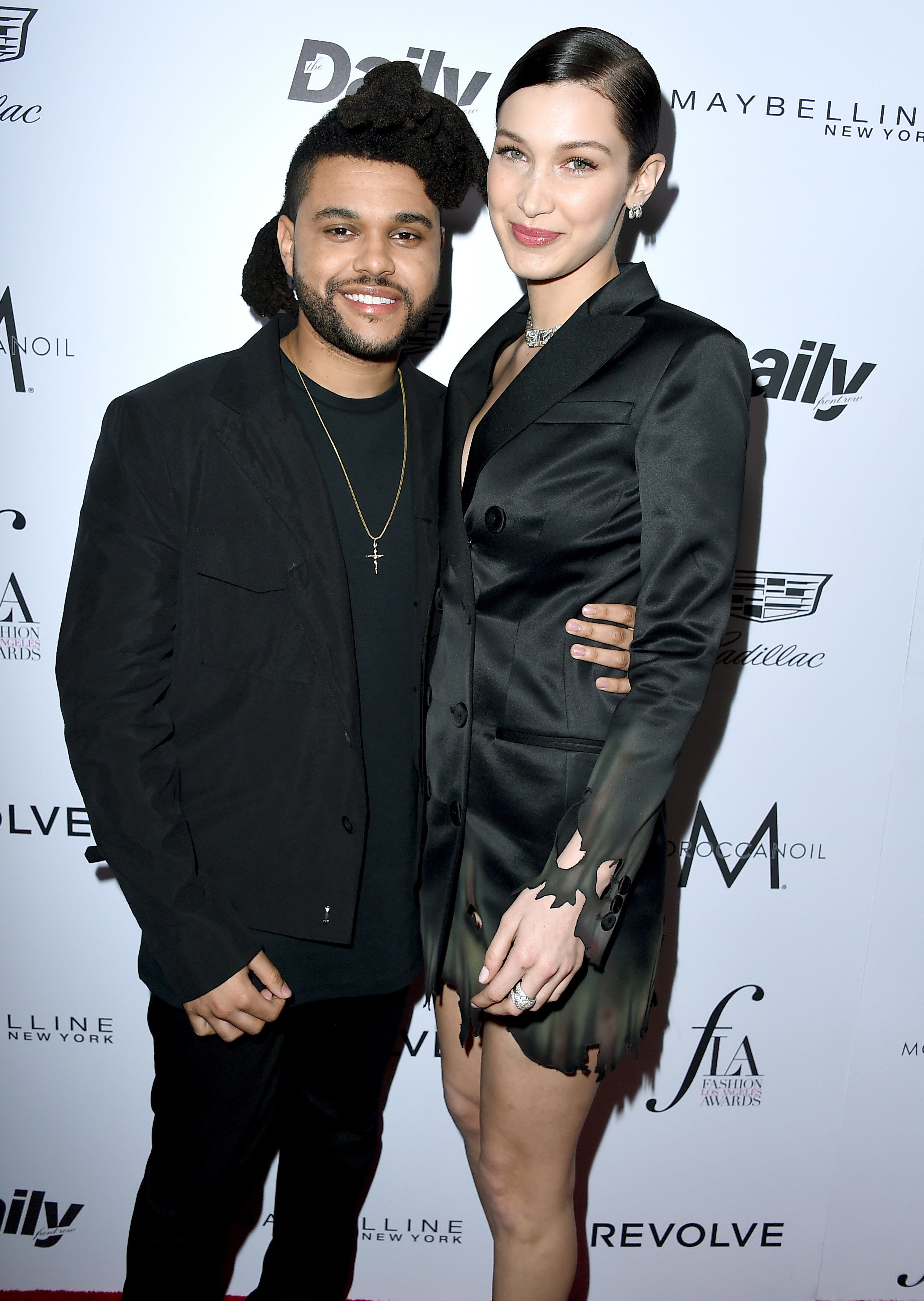 The Weeknd and Bella Hadid smile at the Fashion Los Angeles Awards on March 20, 2016