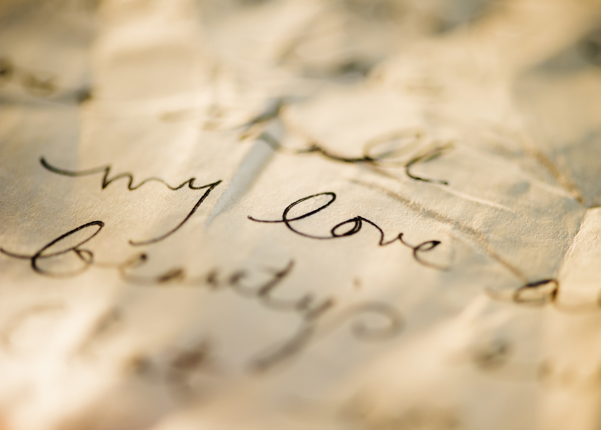 closeup of a letter that says, my love