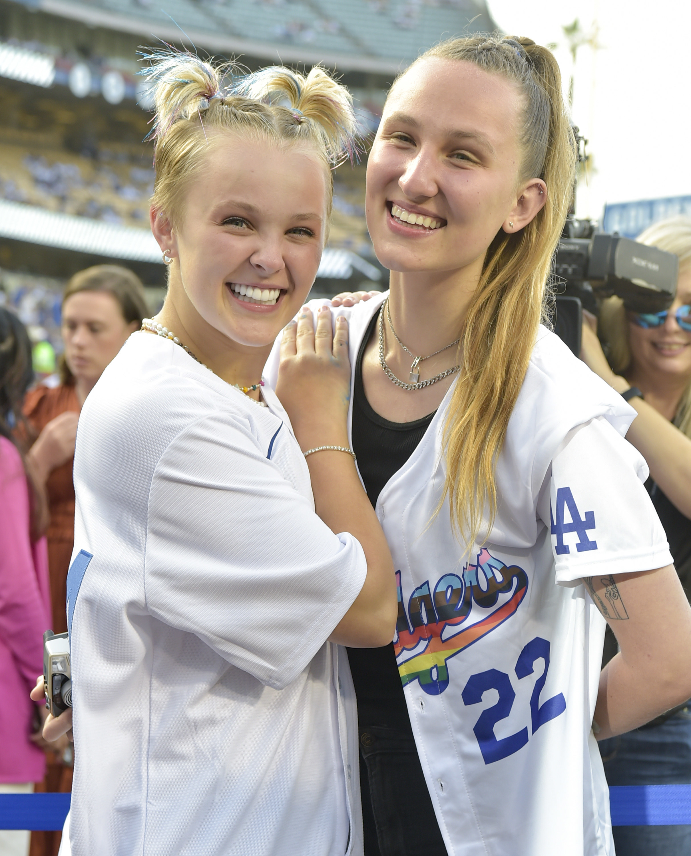 JoJo Siwa and Kylie Prew smile at the LGBTQ+ Night at Dodger Stadium on June 03, 2022