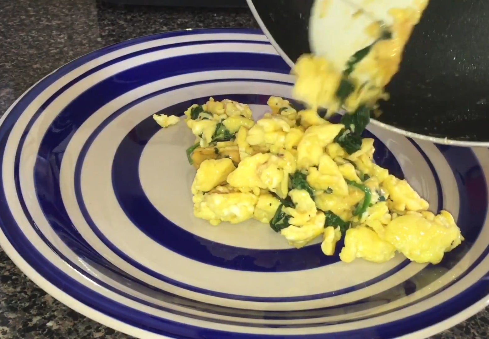 Spinach and eggs from the pan to plate