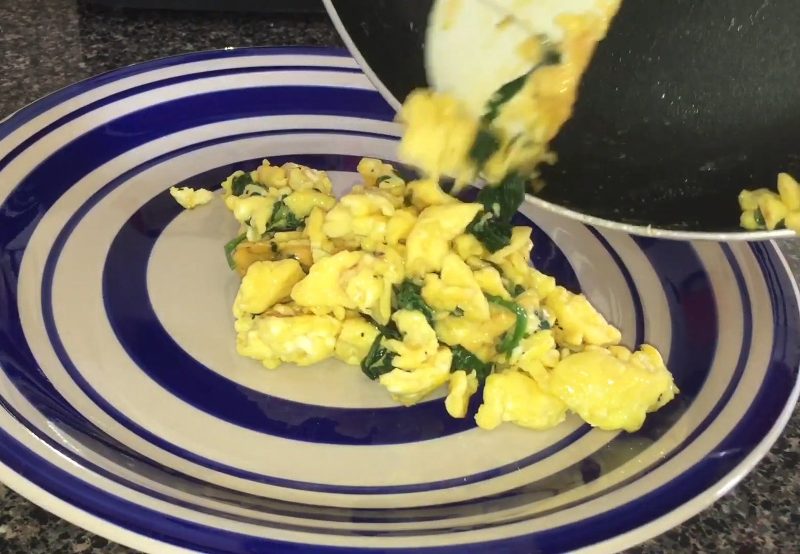 Spinach and eggs from the pan to plate