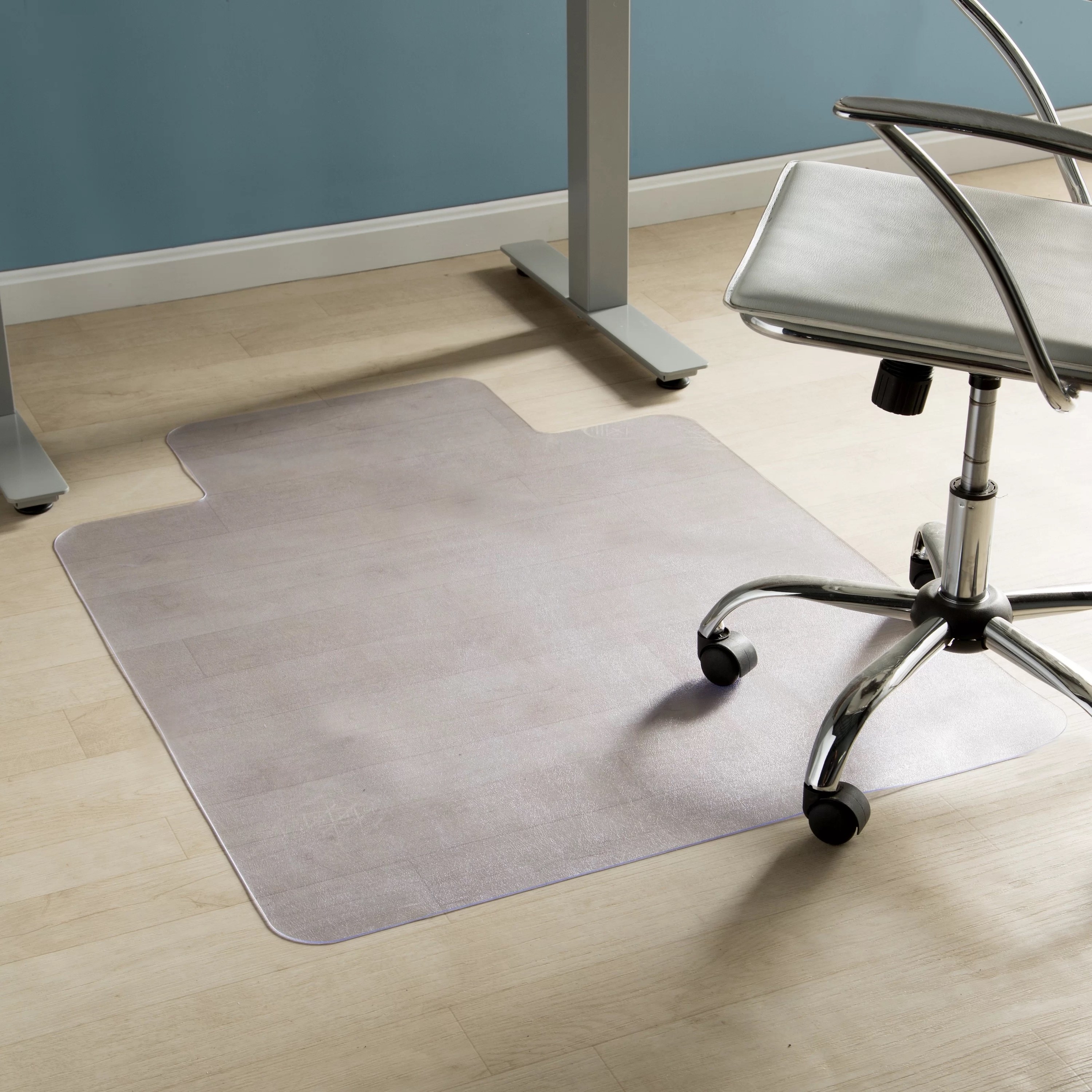 a hard floor chair mat next to an office chair