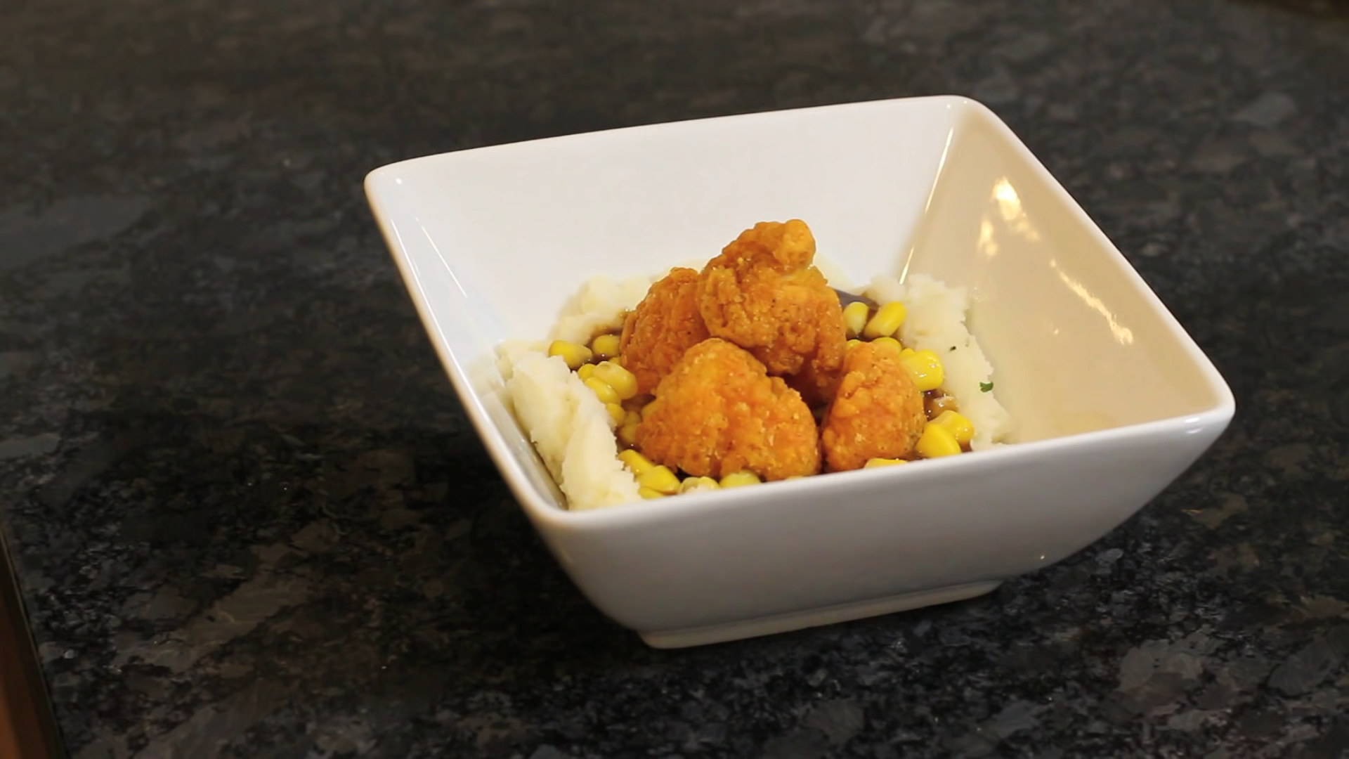 chicken nuggets with mashed potatoes and corn