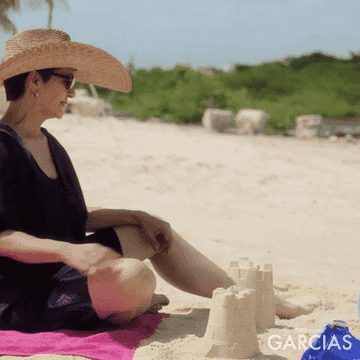 person crushing a sandcastle