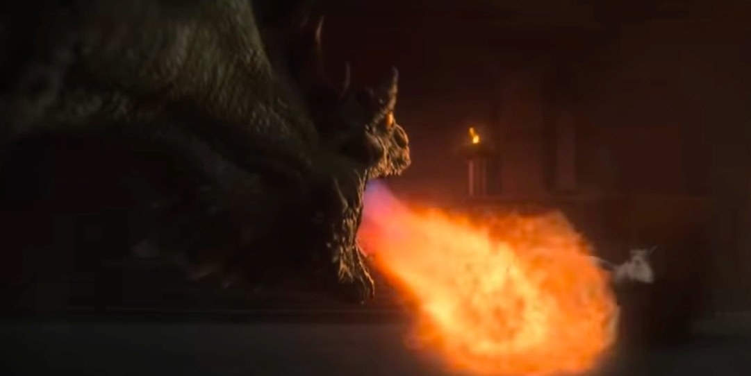 A dragon breathes fire on a goat