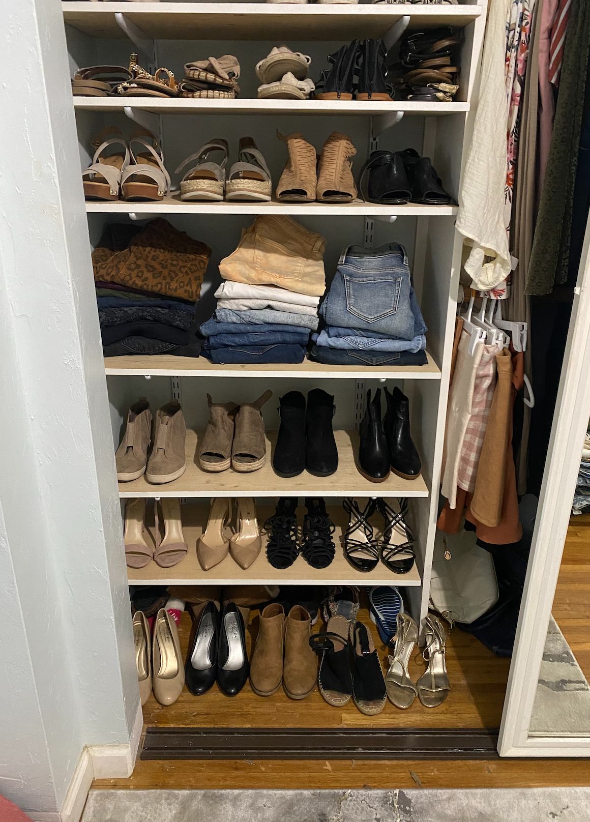 Shoes and folded clothes on shelves