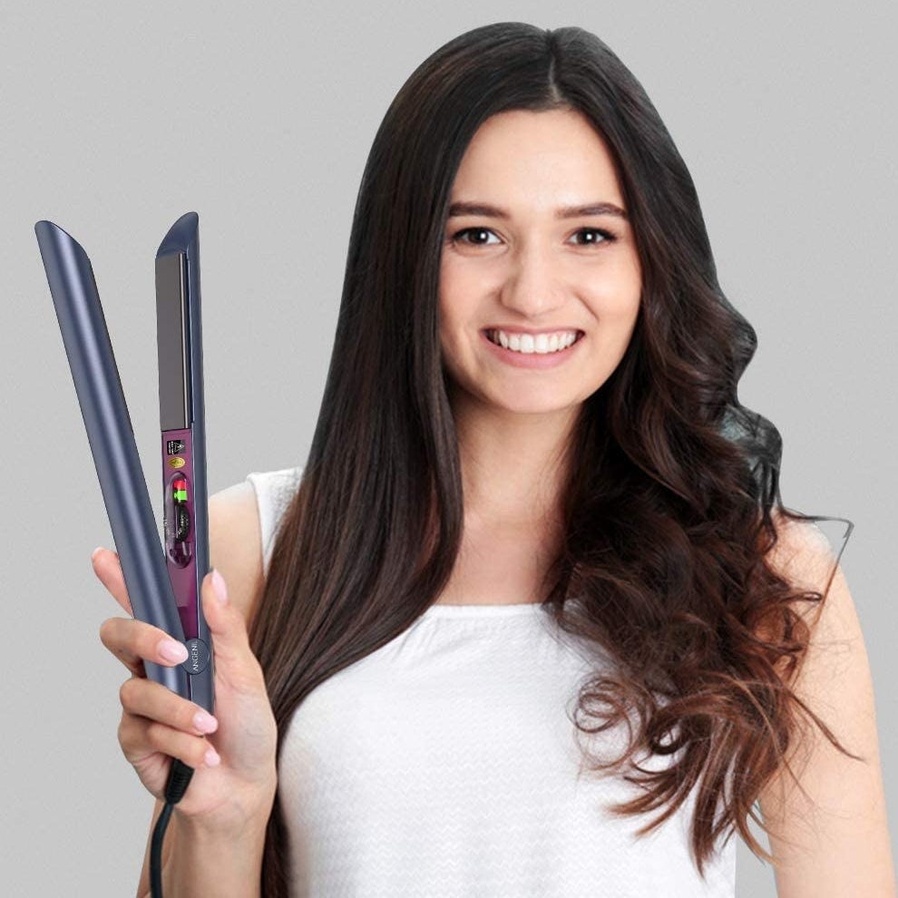 a person holding up the flat iron with curly and straight hair