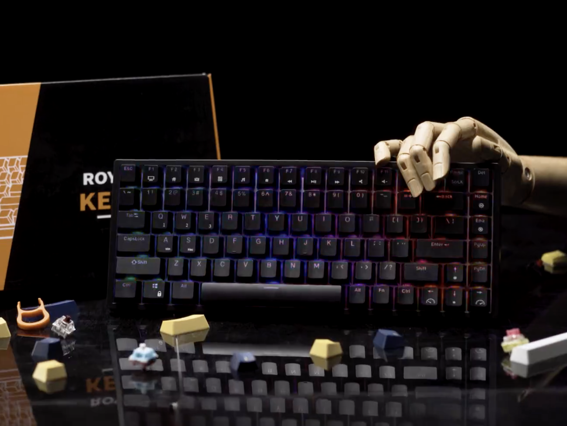 the keyboard against a plain backdrop lit up with a mechanical hand on it