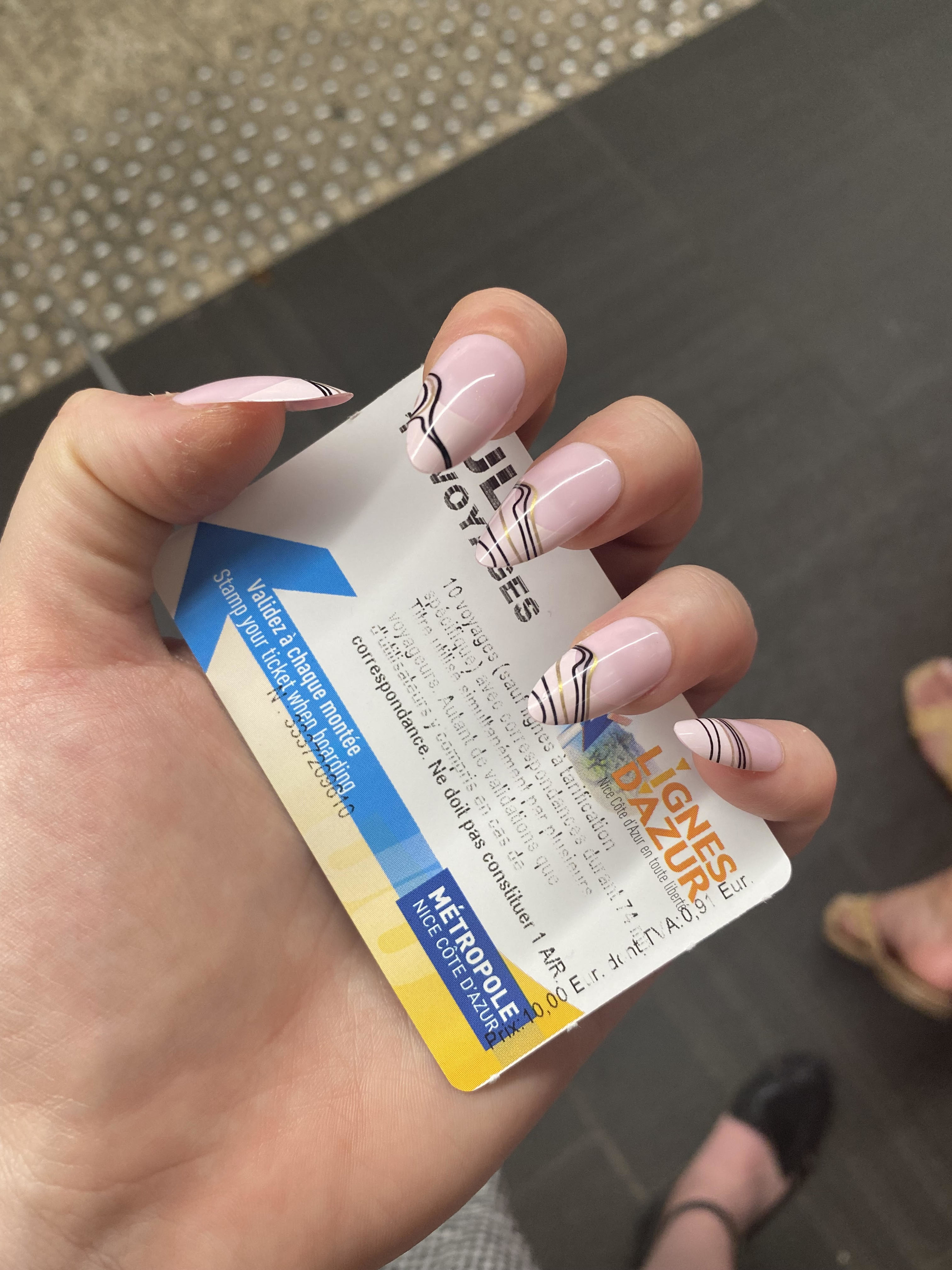 hand holding public transit card for Nice France