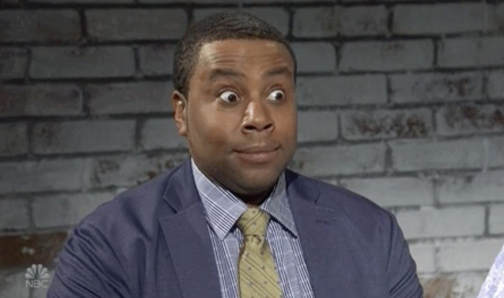 Kenan with a surprised look on his face