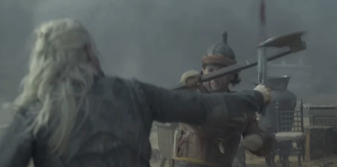 Viserys fighting with his sword against a man holding an axe