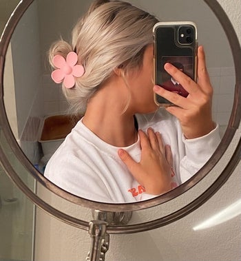 a reviewer wearing their clip in pink