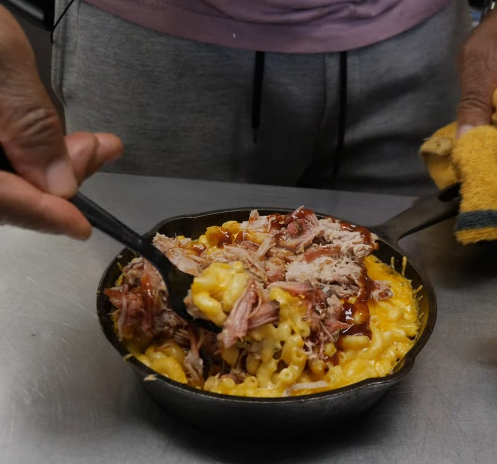 bbq pulled pork with mac and cheese in a small cast iron pan