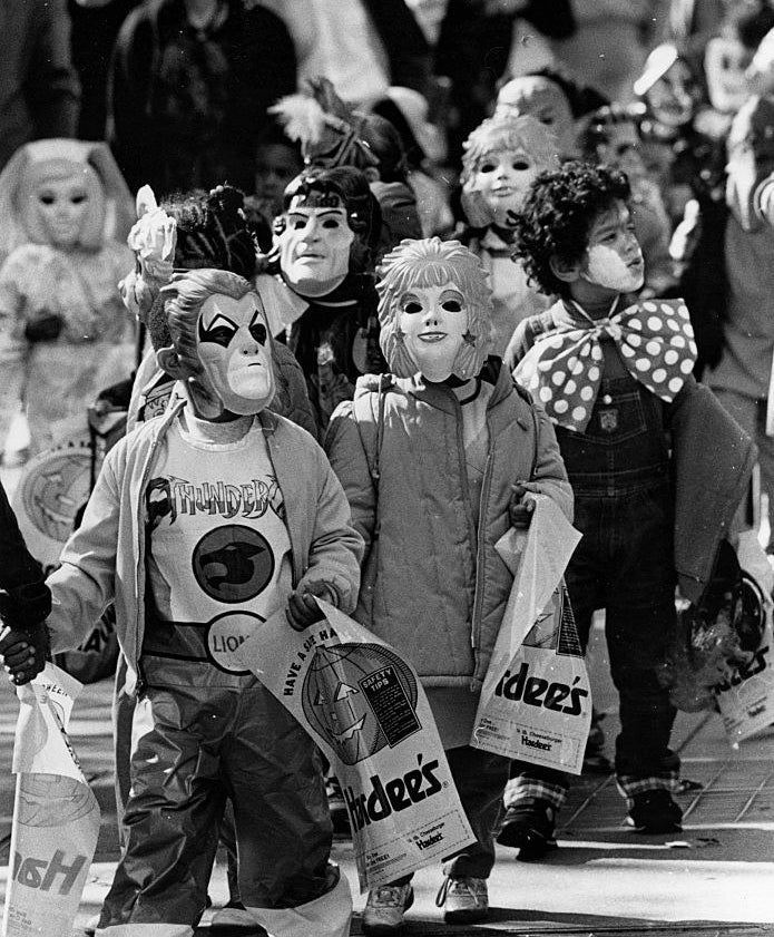 A bunch of kids wearing costumes