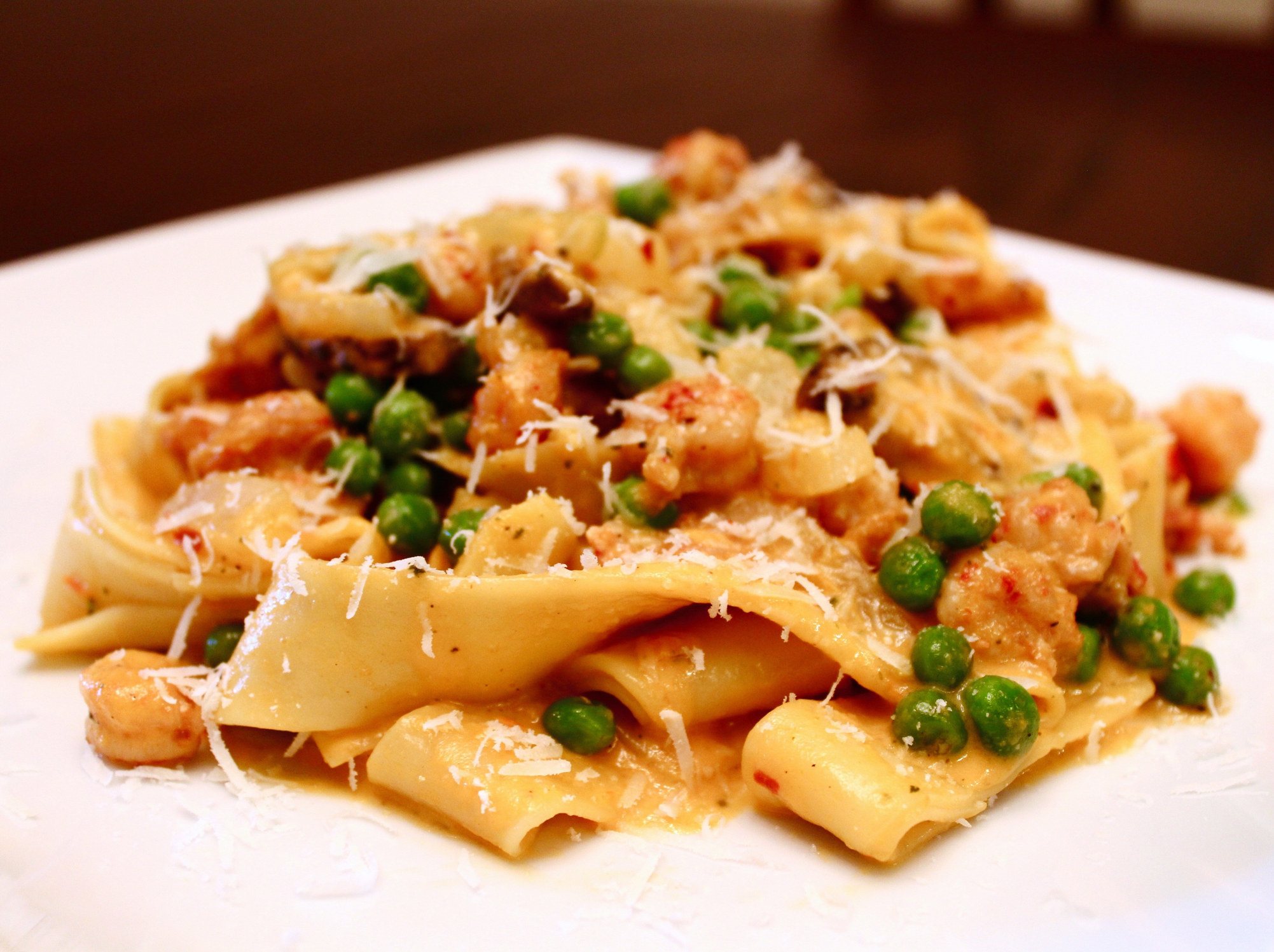 Pasta with tomato sauce and peas.