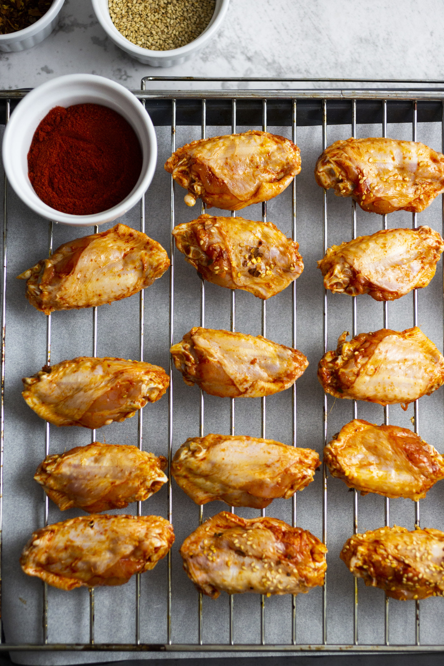 Chicken wings on a cooling wire rack.
