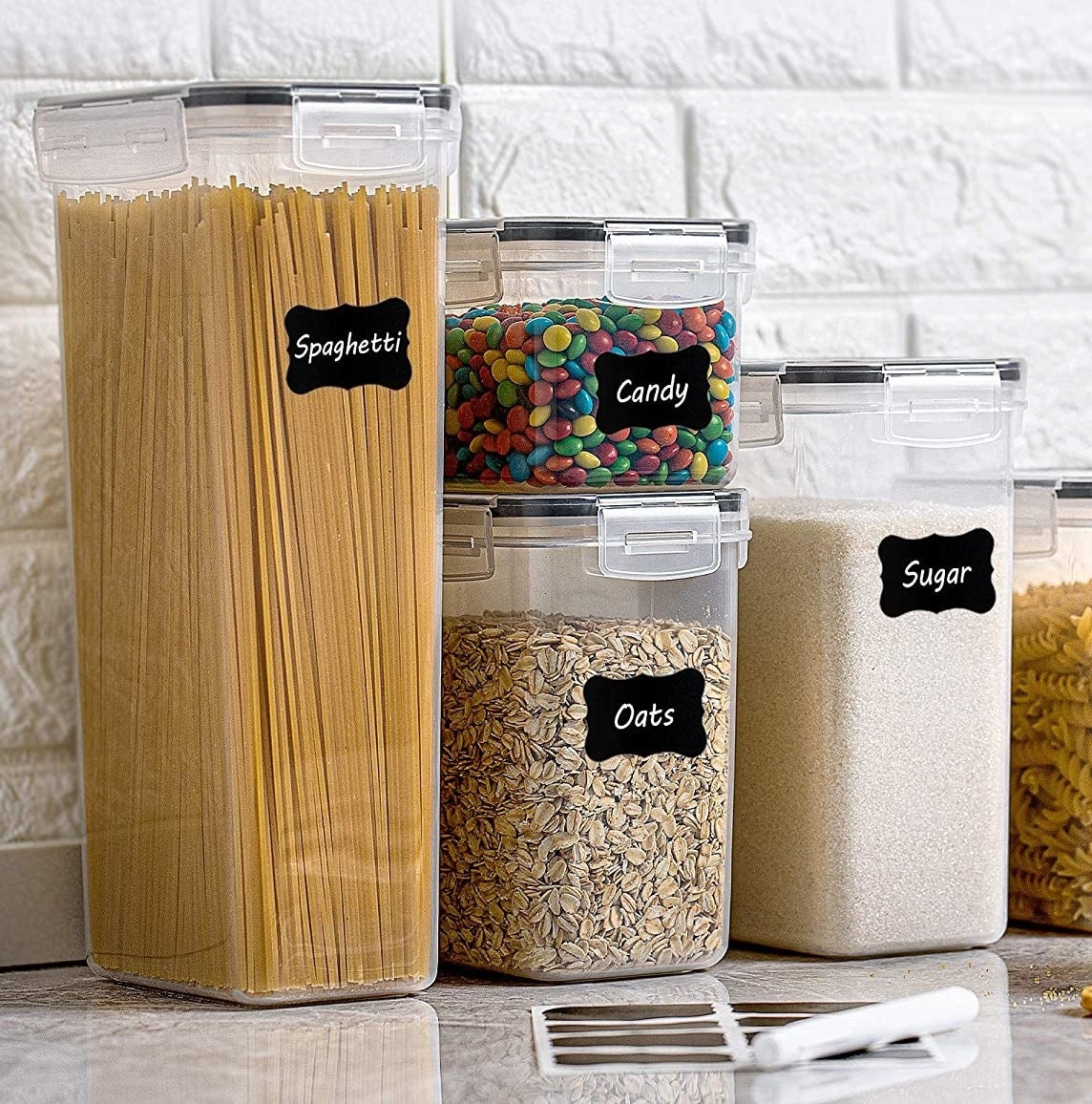 several labelled food storage containers on a counter