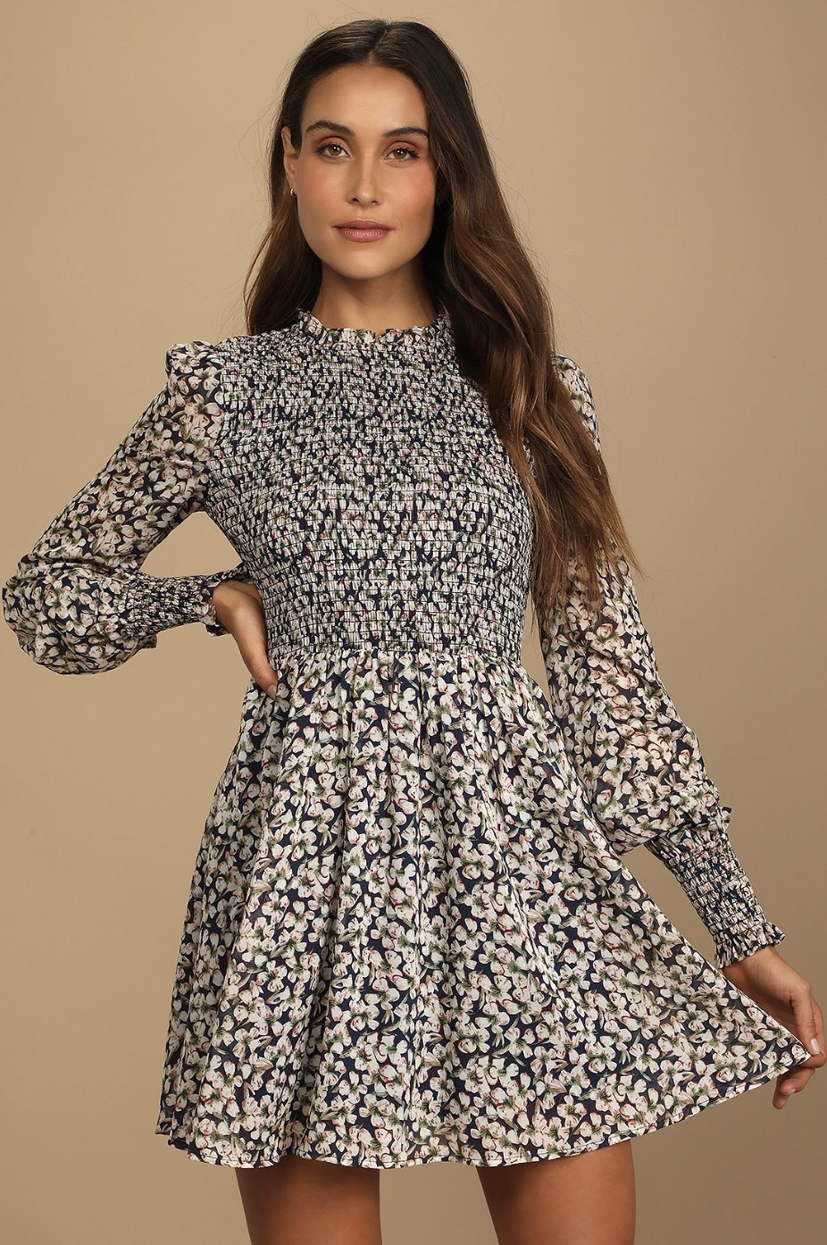 Model in the blue and white floral print dress