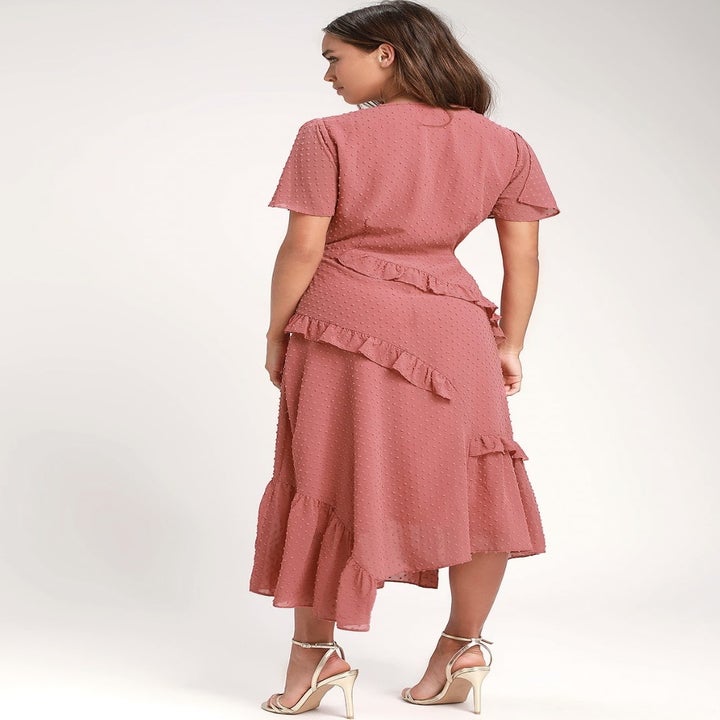 A different model from behind in the pink dress
