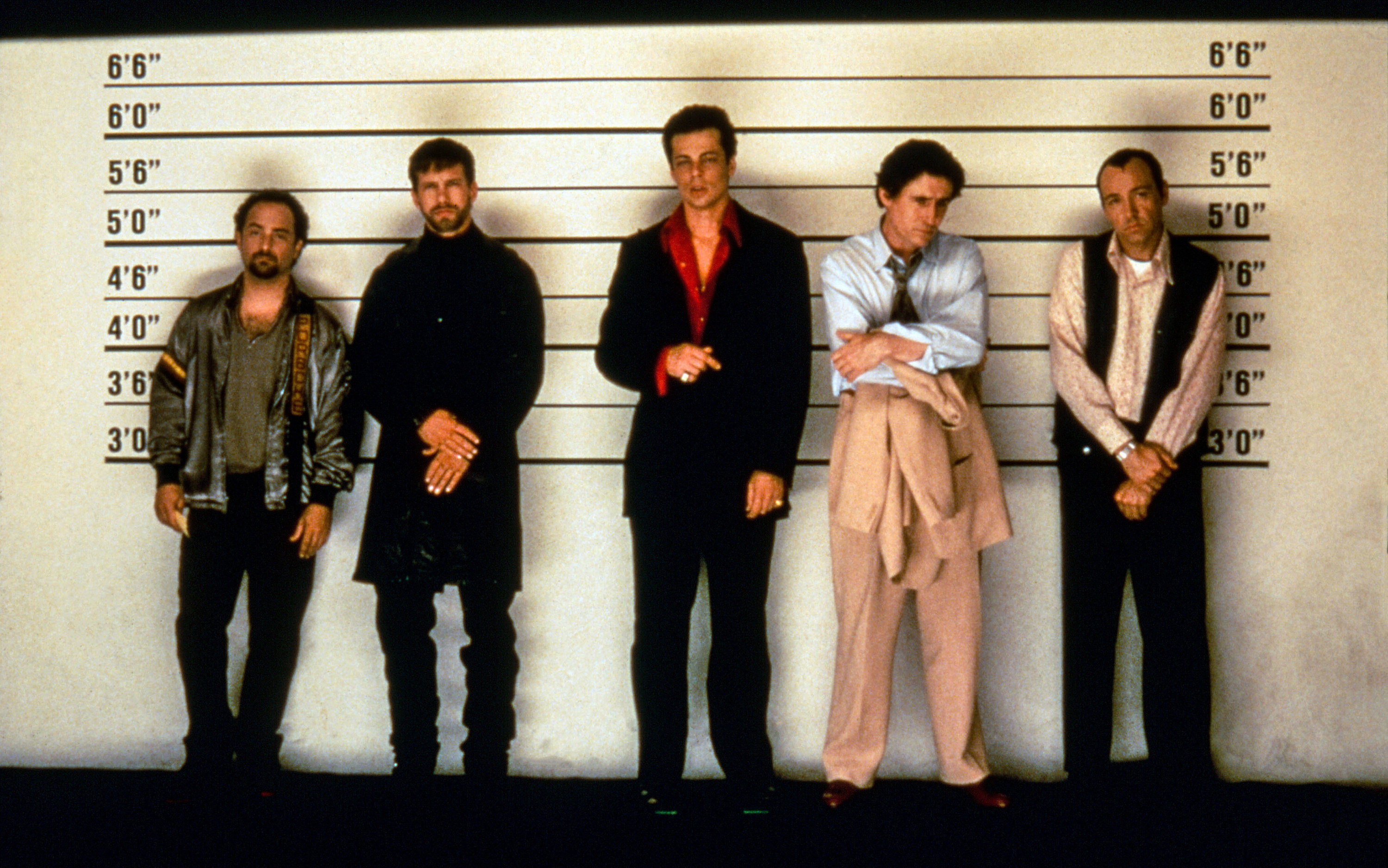 A group of criminals stand in front of a line-up