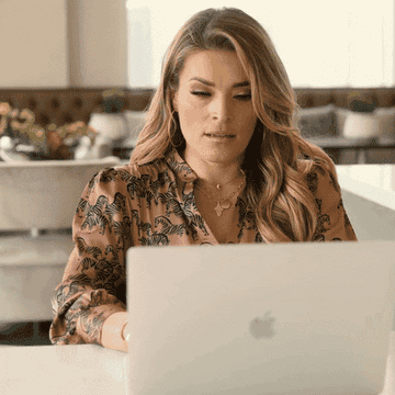 Gif of Jasmine Star sitting at a laptop, before closing her eyes in frustration and leaning back in her chair