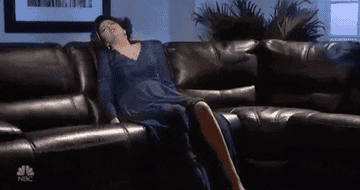 a gif of a character in an SNL sketch relaxing on a recliner
