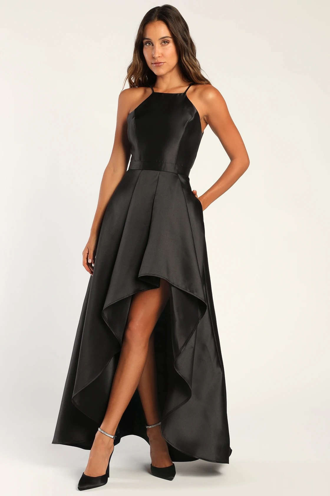Model wearing black dress with black heels