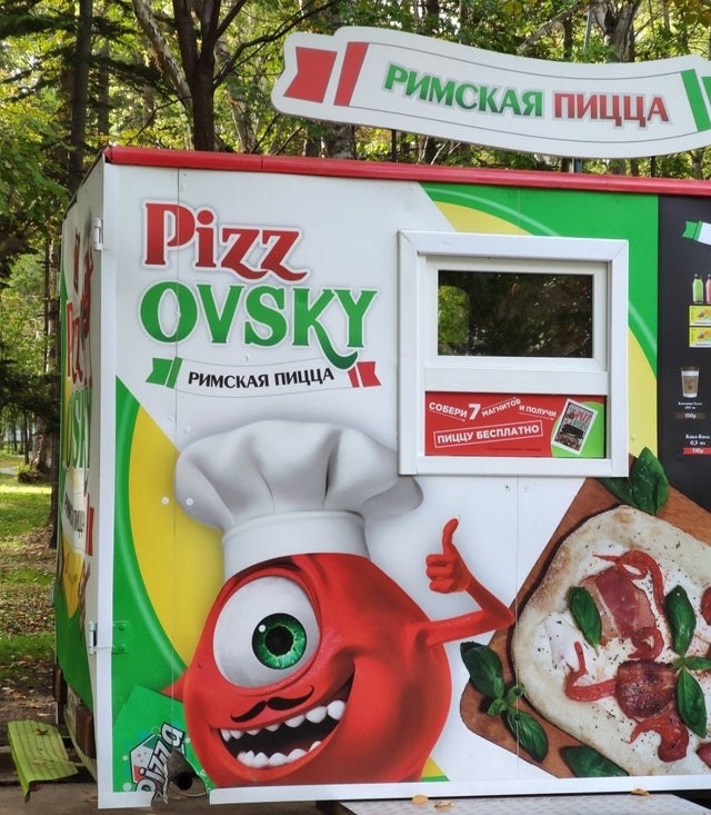 mascot that looks like Mike Wazowski on a pizza truck