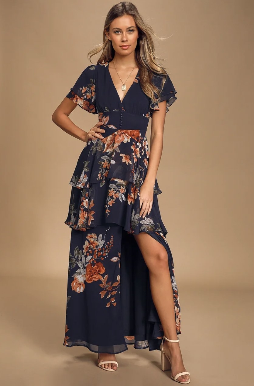 model wearing the dress in blue with floral print