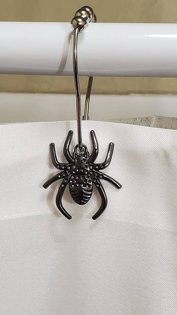 A close up of the reviewer's spider shower hooks