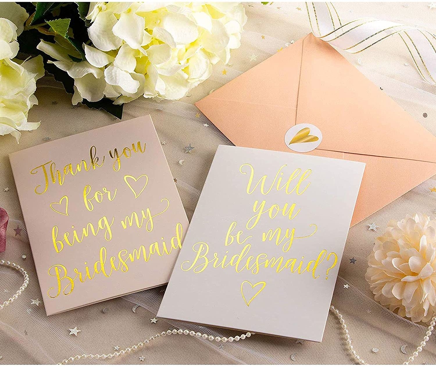 two cards that say thank you for being my bridesmaid and will you be my bridesmaid
