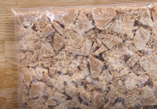broken up pieces of toffee in a plastic bag