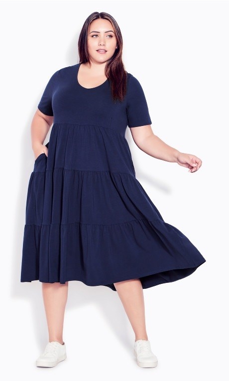 model wearing navy blue swing tiered dress