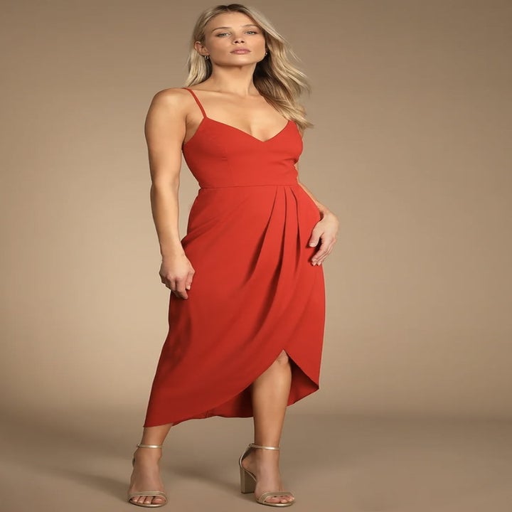 Model in the red faux-wrap spaghetti-strap dress
