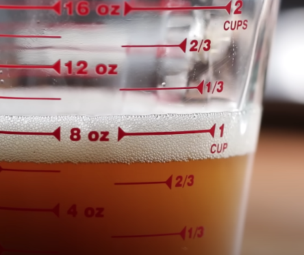 A measuring cup full of liquid