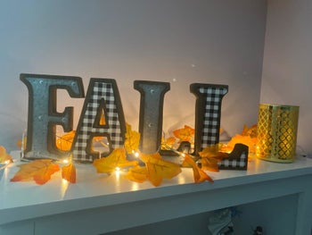 reviewer's photo of the lit up leaf garland decoration