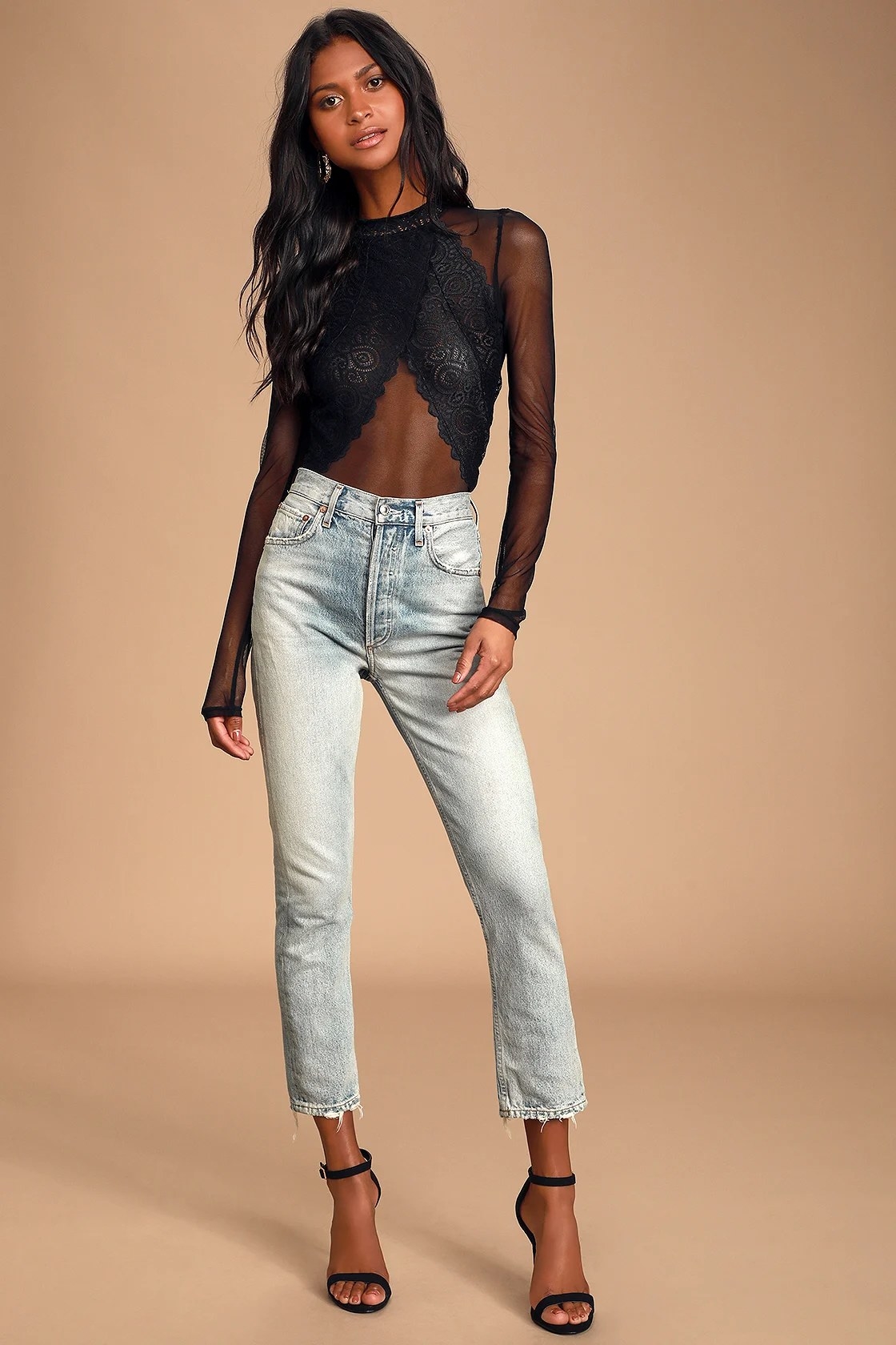 Model wearing bodysuit with jeans