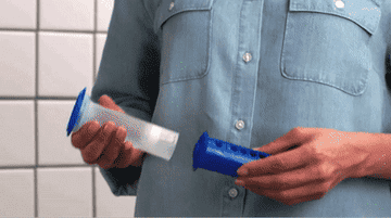 a gif of a person using the stamp in a toilet