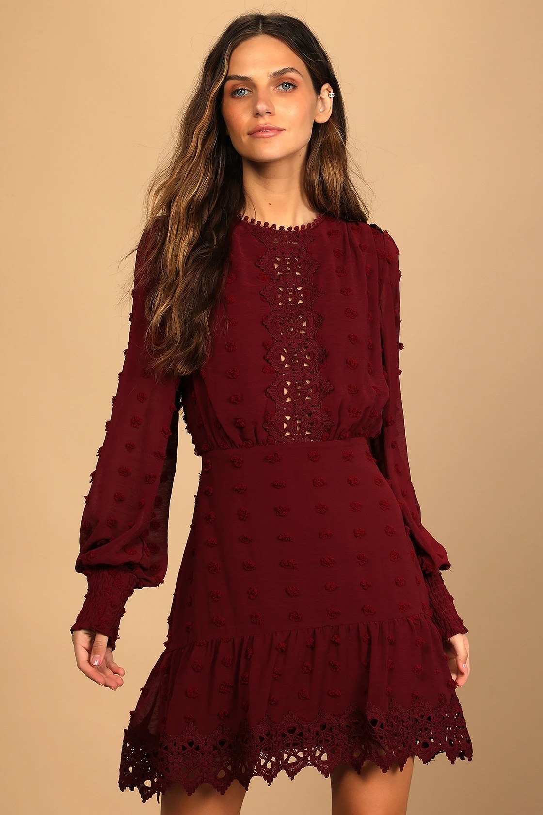 Model wearing wine colored dress