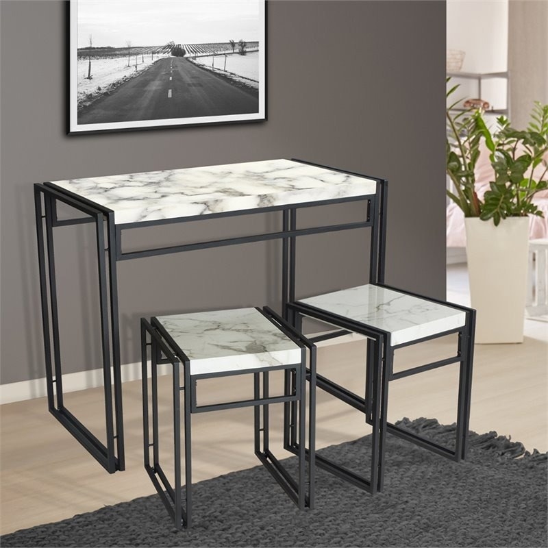 the black metal and marble dining set
