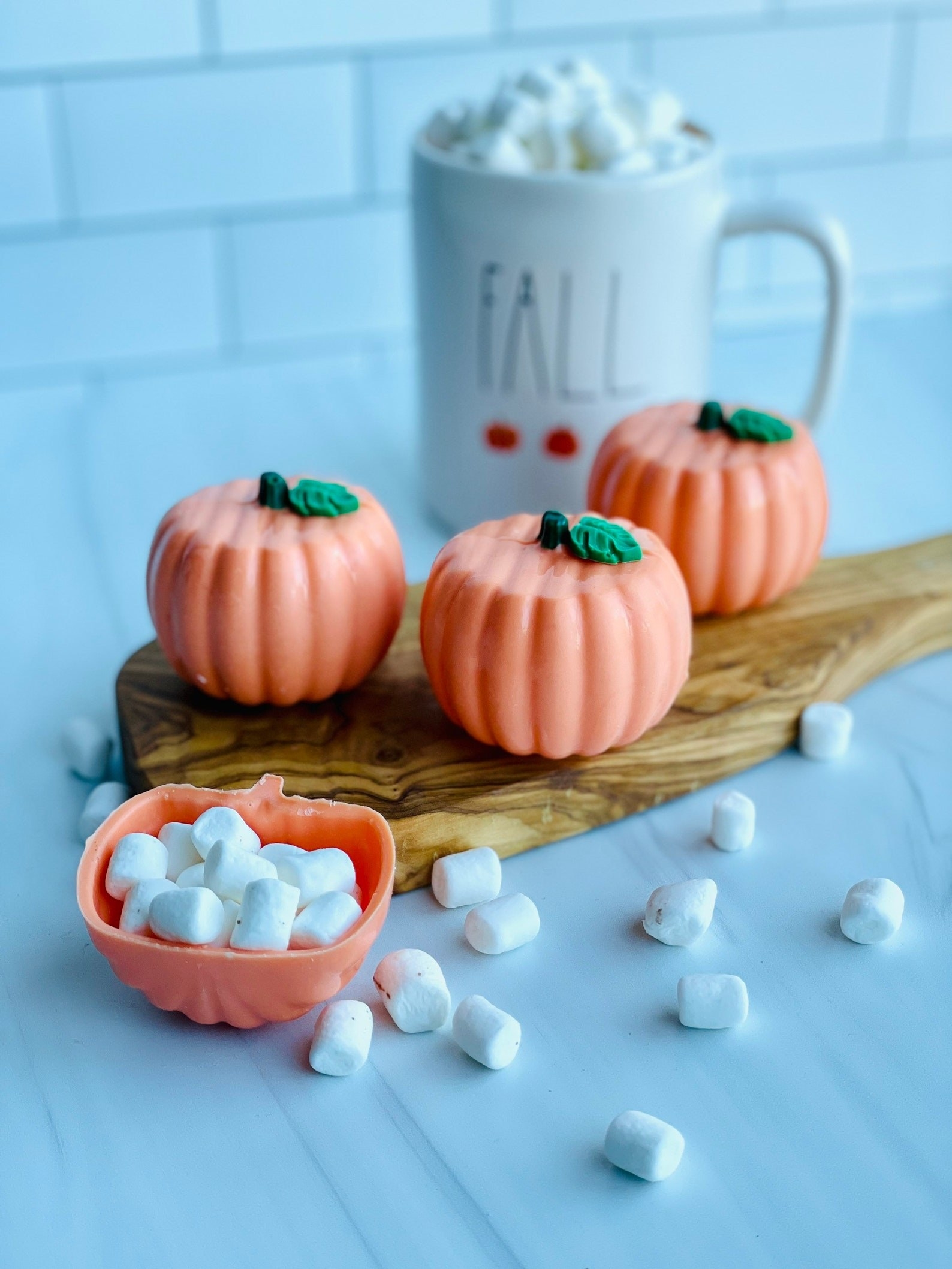 The pumpkin hot chocolate bombs with mini marshmallows inside