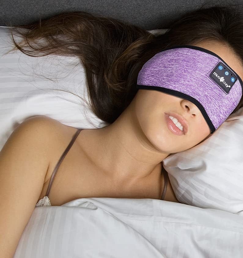 A person sleeping while wearing the mask