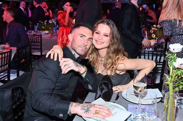 Adam and his wife Behati at a dinner event