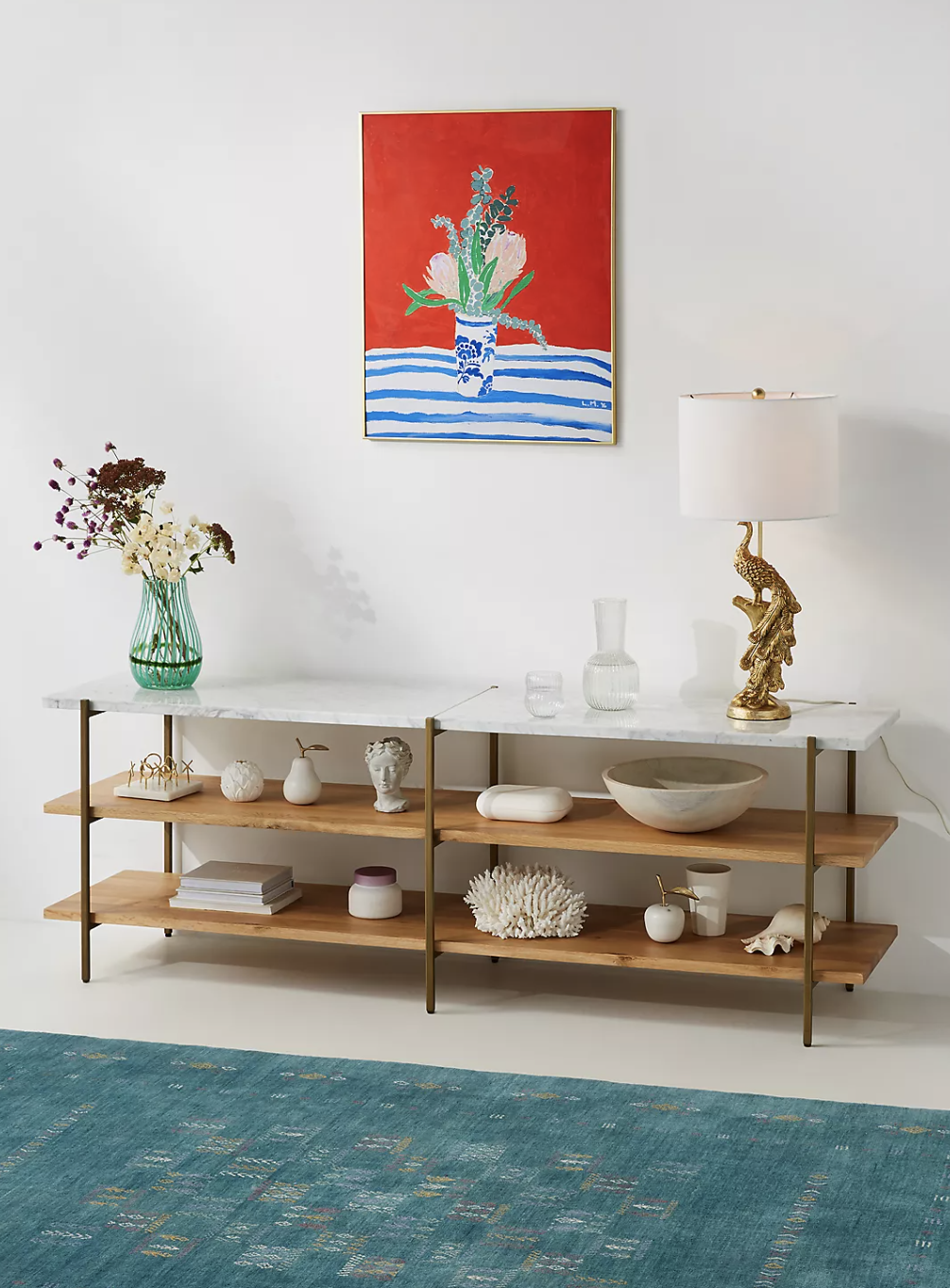 the natural colored console table with decor on it