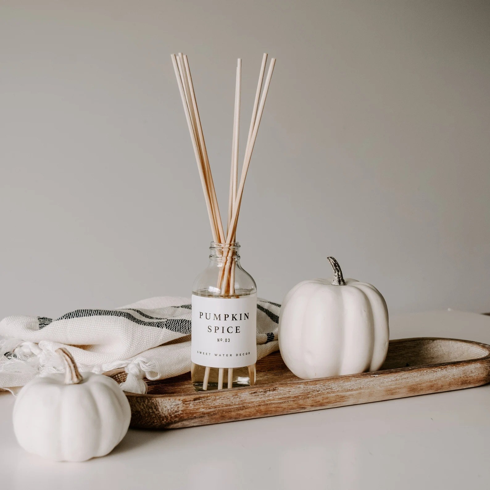 Pumpkin Spice reed diffuser placed on decor tray