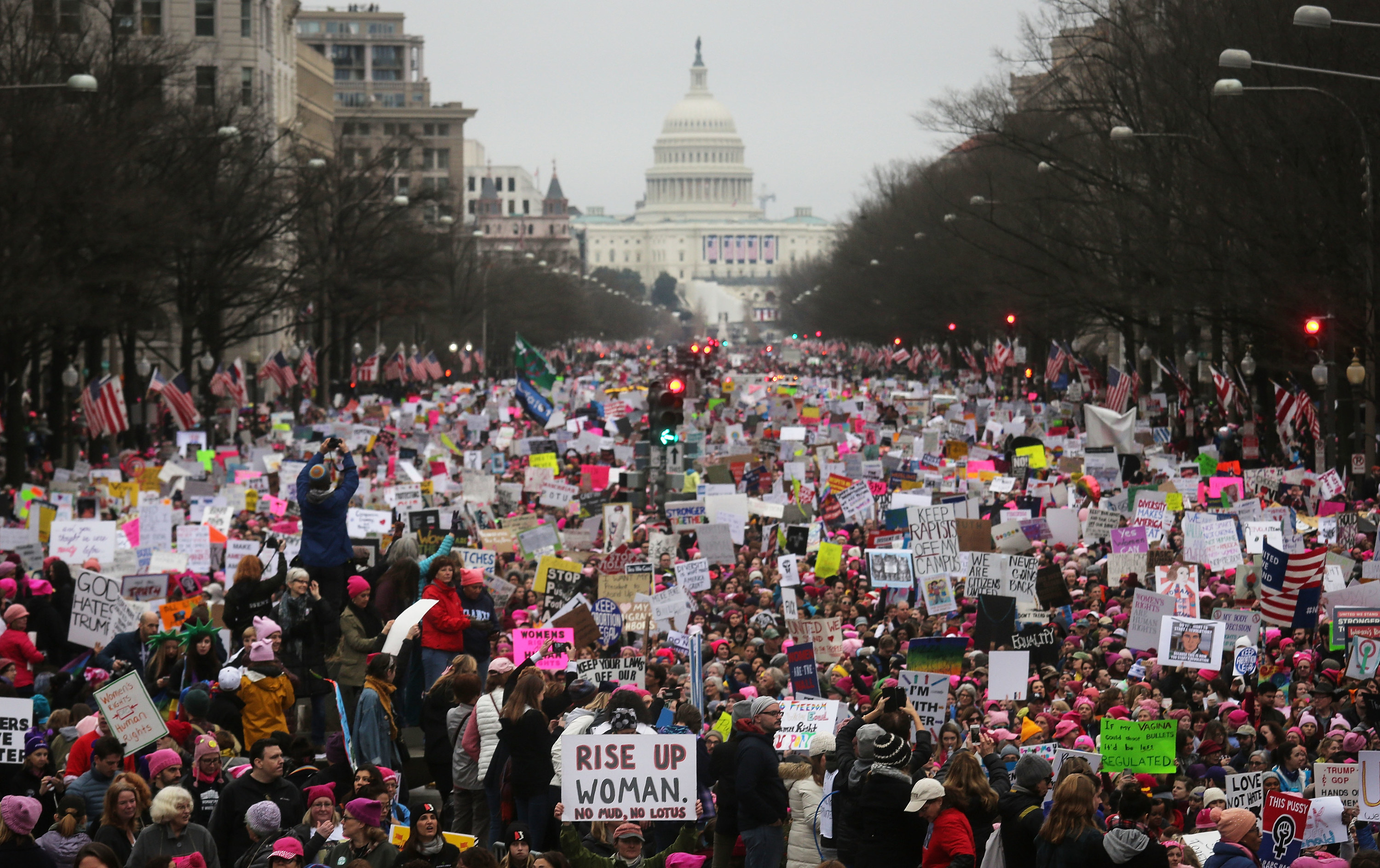 Protesters walk during the Women&#x27;s March on Washington, with the U.S. Capitol in the background, on January 21, 2017 in Washington, DC.