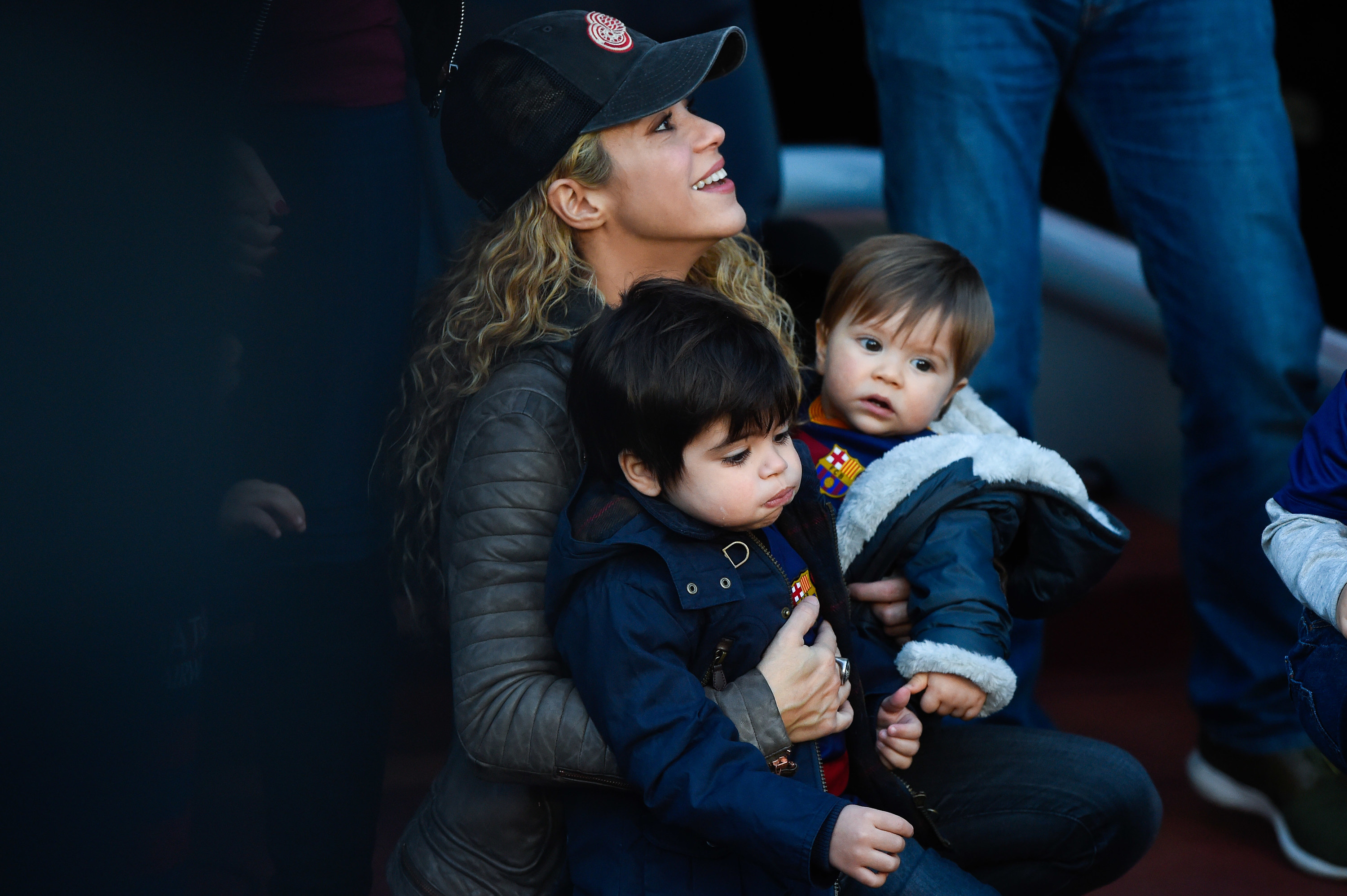 Shakira holds her two childen