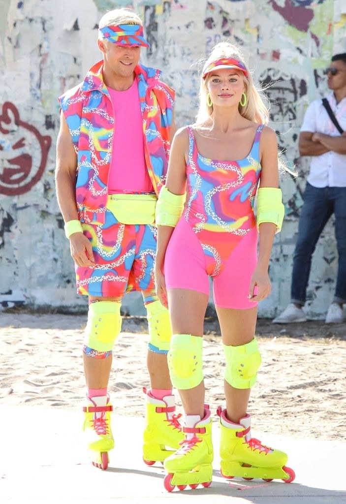 close up of the two at the beach in roller blade gear